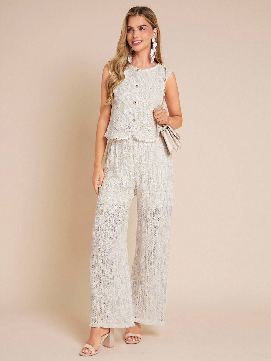 Woman wearing a light-colored lace outfit on a beige background