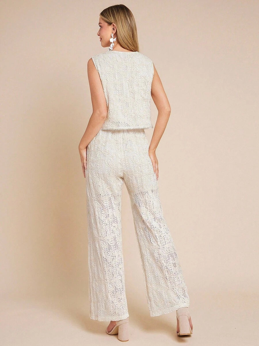 Woman wearing a white lace outfit on a beige background