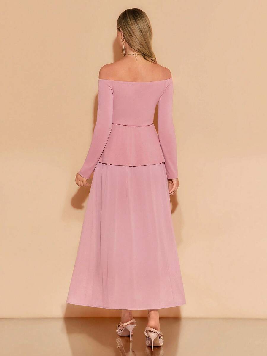 Woman wearing a pink off-shoulder top and skirt set against a beige background