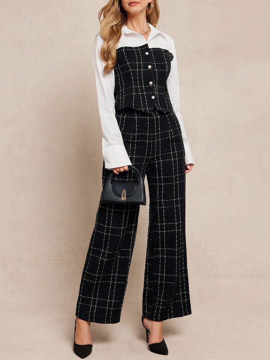 Woman wearing a black checkered jumpsuit over a white shirt on a beige background