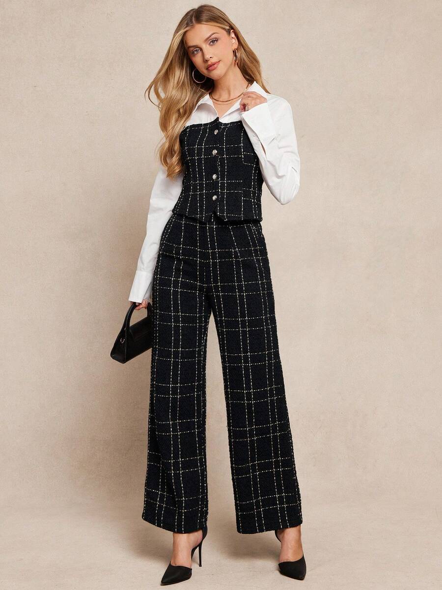 Woman wearing a black checkered jumpsuit over a white shirt on a beige background