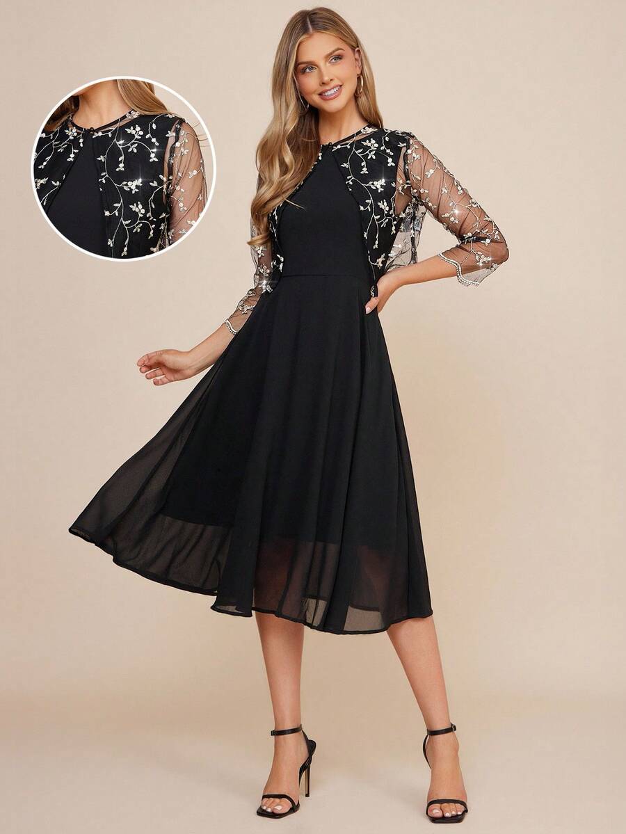 Black dress with sheer sleeves and floral lace details on a beige background
