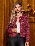 Woman wearing a red plaid jacket in front of a gold curtain