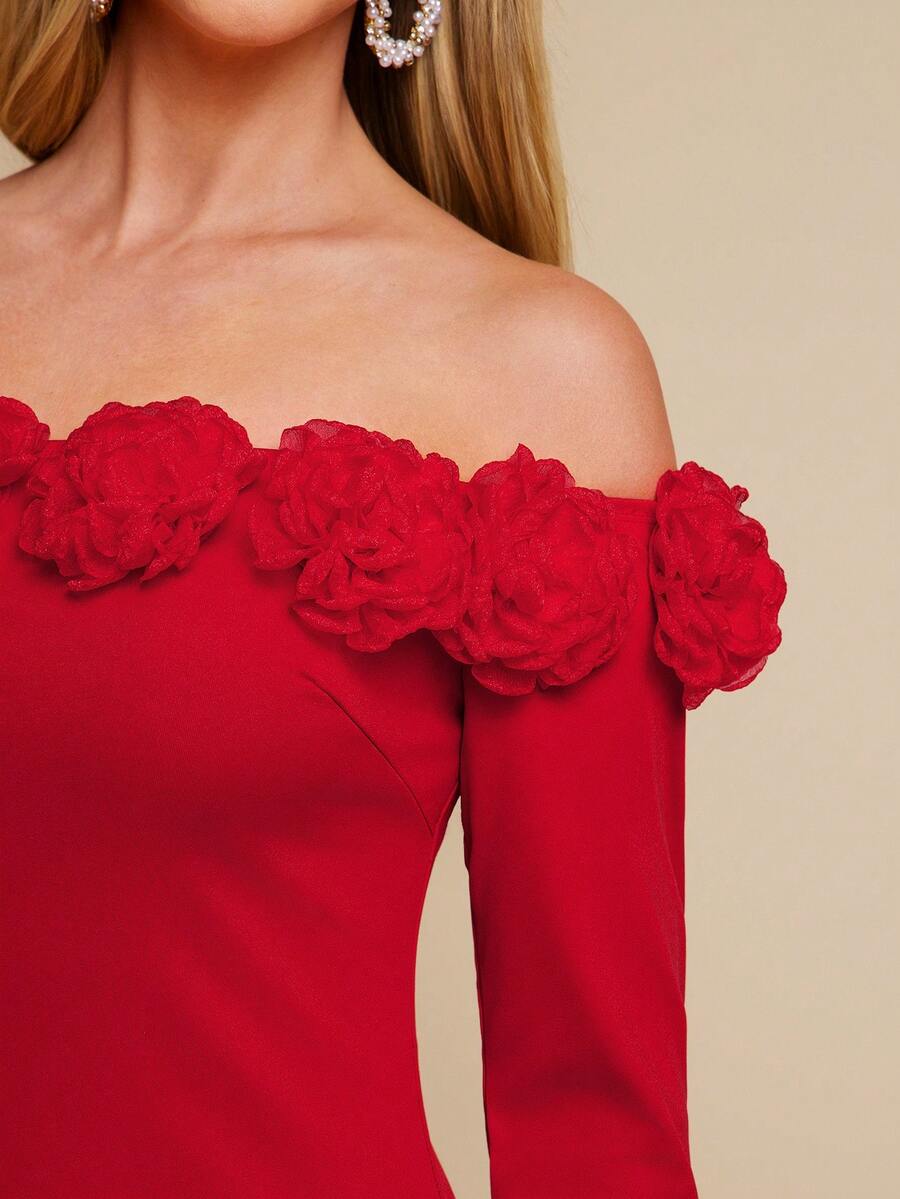 Red off-shoulder dress with floral details on a beige background