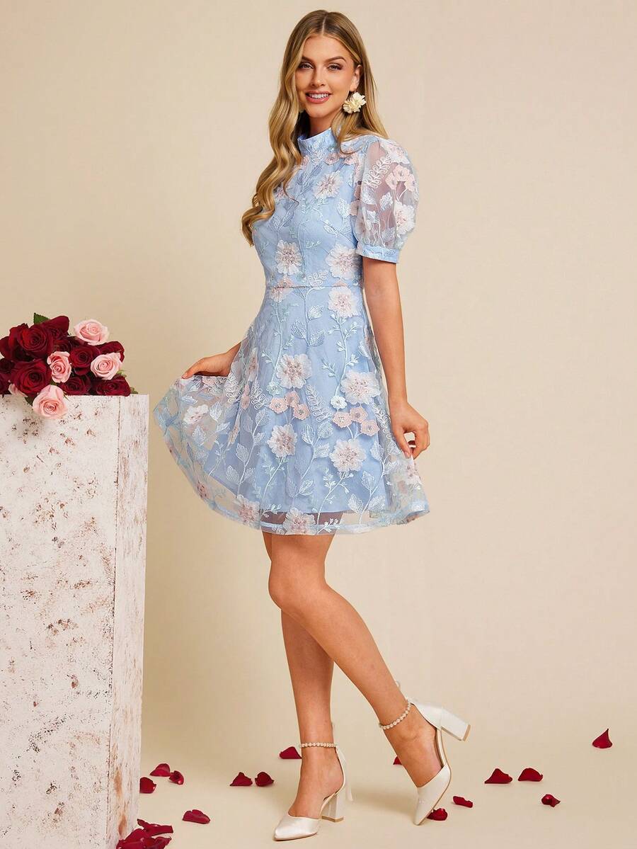 Woman wearing a light blue floral dress on a beige background
